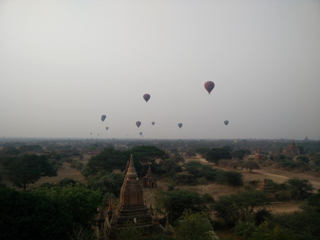 Bagan hot air balloons taking off at sunrise.